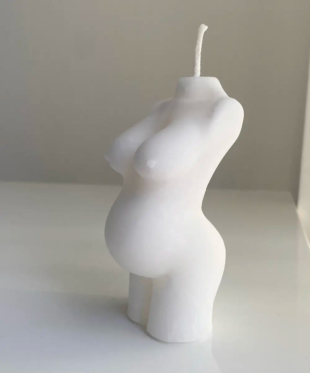 stearinljus i form av en gravid kvinnokropp